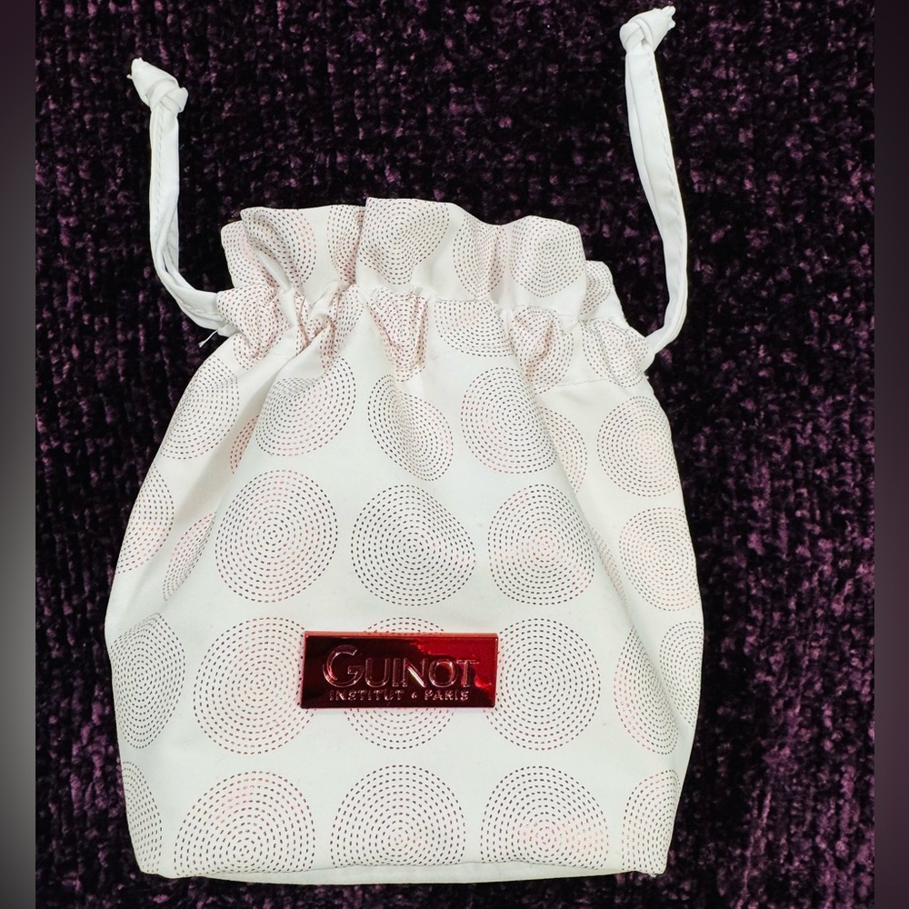 A gift bag with drawstrings from the cosmetics brand Guinot (France)